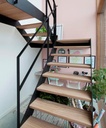 Escalier métallique avec afrormosia dans une maison de maître